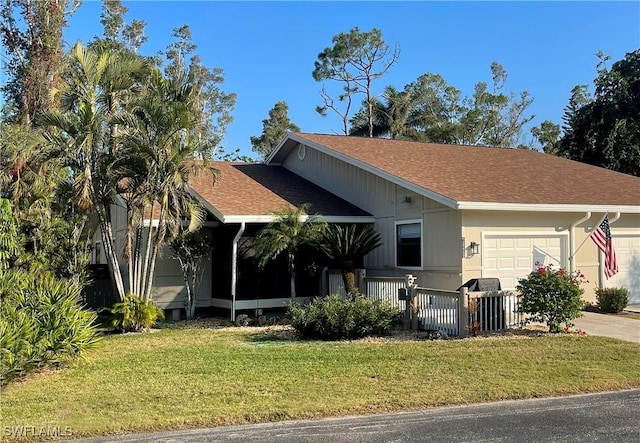 view of front facade featuring a front lawn and a garage