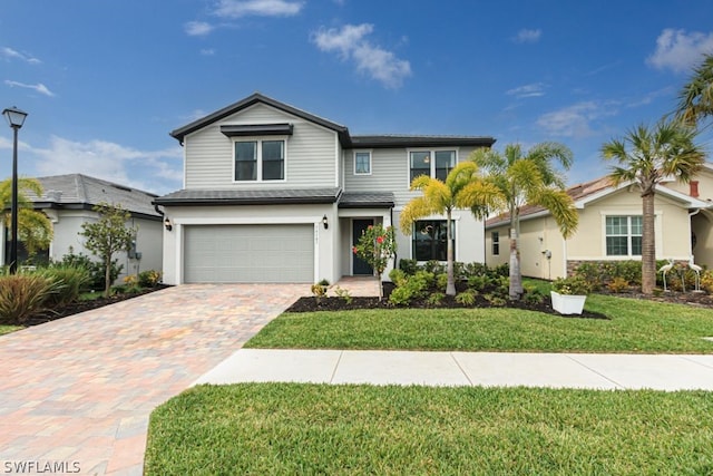 view of front facade with a front lawn and a garage