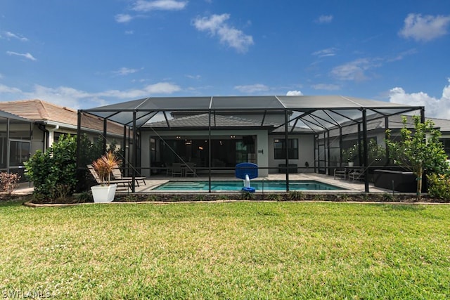 back of house with glass enclosure, a yard, and a patio