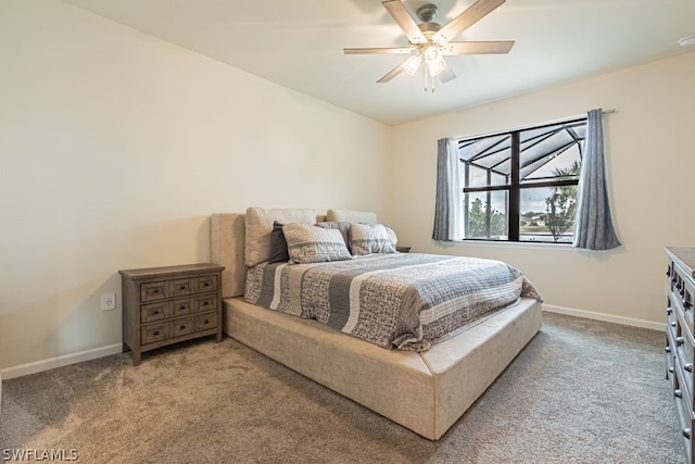 bedroom featuring light colored carpet and ceiling fan