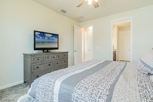 bedroom featuring ensuite bath, ceiling fan, and light colored carpet