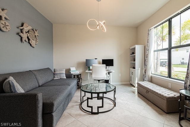 living room featuring a chandelier and light tile flooring