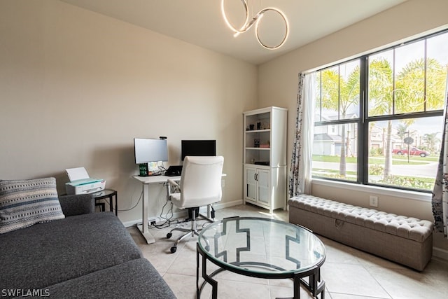 office area featuring a chandelier and light tile floors