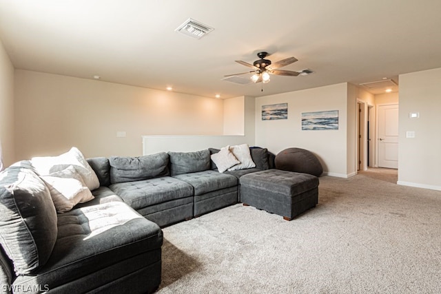 carpeted living room with ceiling fan