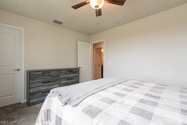 bedroom with dark colored carpet and ceiling fan