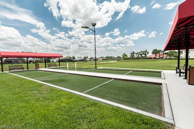 view of home's community with a lawn