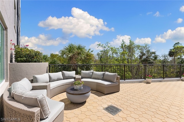 view of patio / terrace with an outdoor hangout area and a balcony