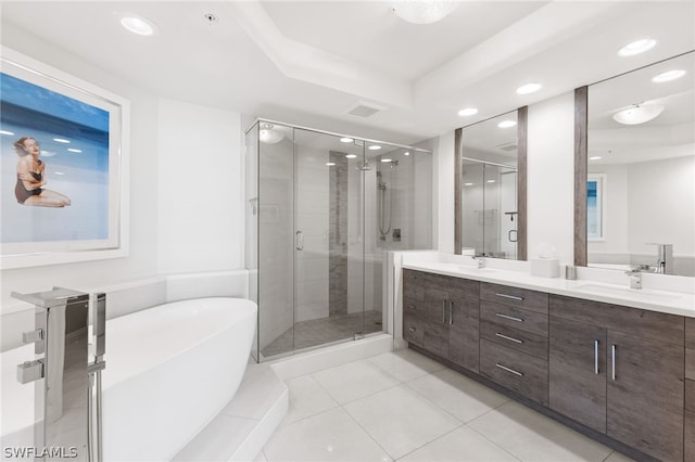 bathroom with vanity, tile patterned flooring, and shower with separate bathtub