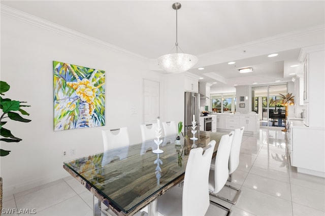 dining room with light tile patterned floors and crown molding