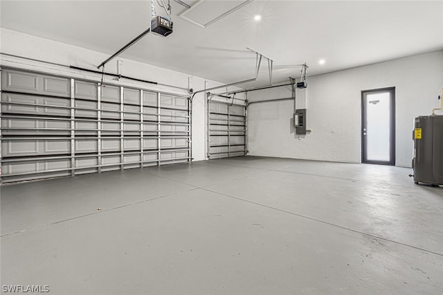 garage with water heater and a garage door opener