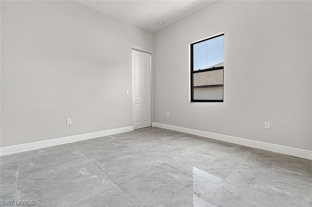 empty room featuring light tile floors