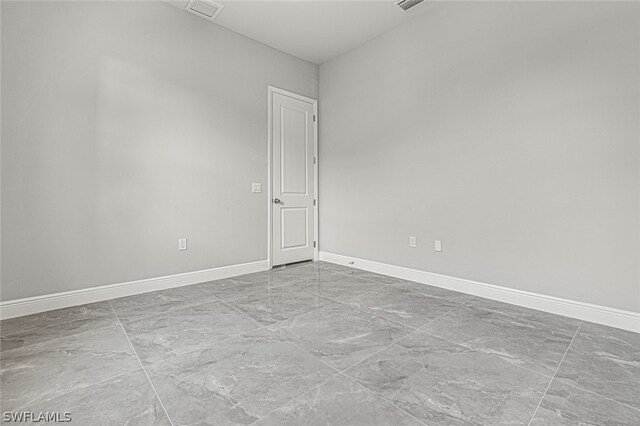 empty room with light tile flooring