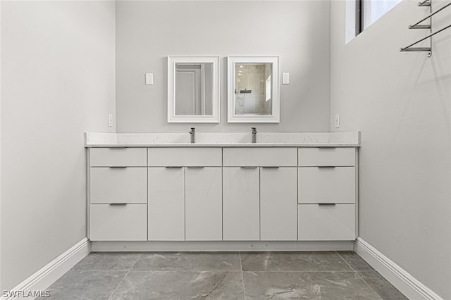 bathroom with vanity and tile floors