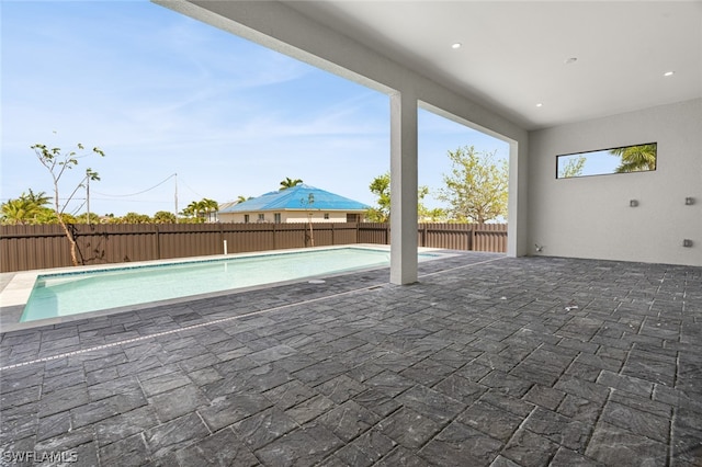 view of patio featuring a fenced in pool