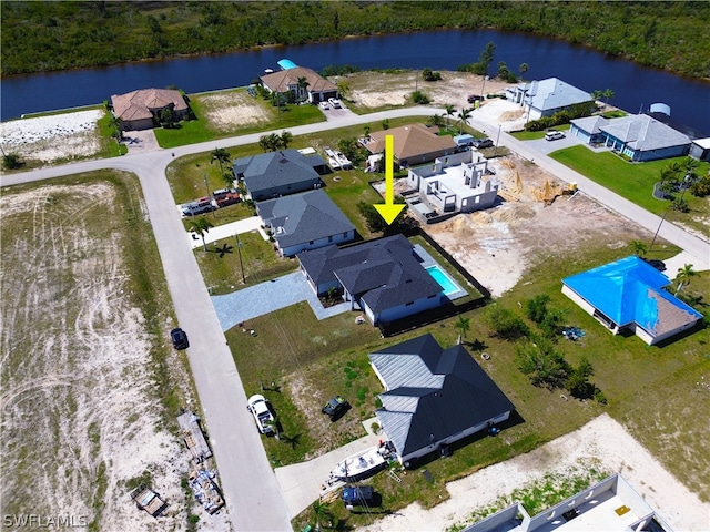 drone / aerial view featuring a water view