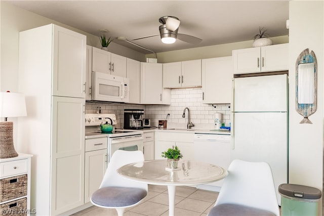 kitchen with backsplash, ceiling fan, white appliances, sink, and white cabinets