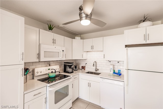 kitchen with white appliances, ceiling fan, sink, backsplash, and white cabinetry