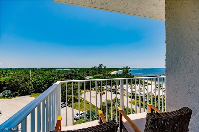 balcony featuring a water view