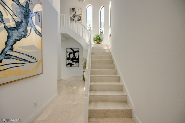 stairs featuring light tile floors