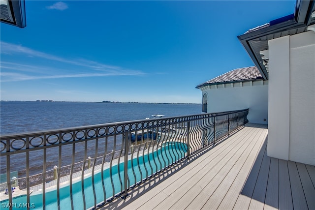 wooden terrace with a water view