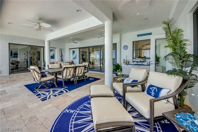 view of patio with an outdoor hangout area and ceiling fan