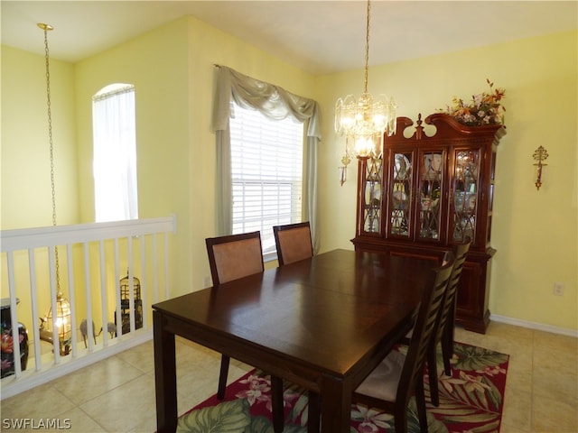 dining room featuring light tile patterned floors and a chandelier