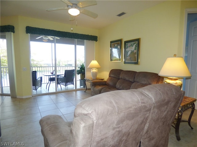 living room featuring ceiling fan and light tile patterned floors