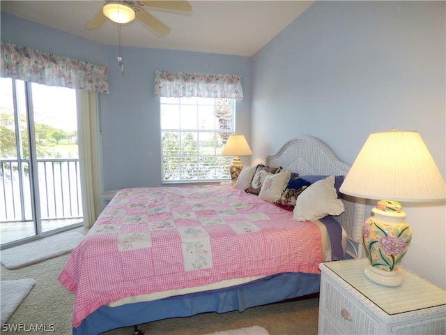 bedroom featuring access to outside, ceiling fan, and carpet