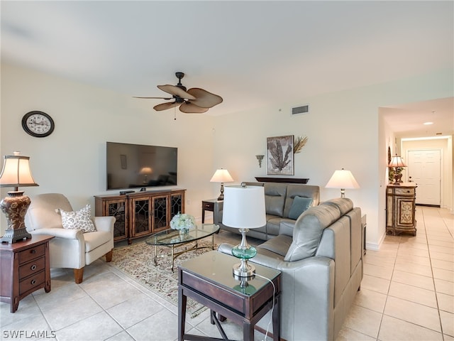 tiled living room featuring ceiling fan