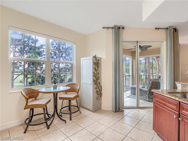 interior space featuring light tile patterned floors and sink