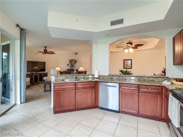 kitchen featuring dishwasher, a raised ceiling, range with electric cooktop, sink, and kitchen peninsula