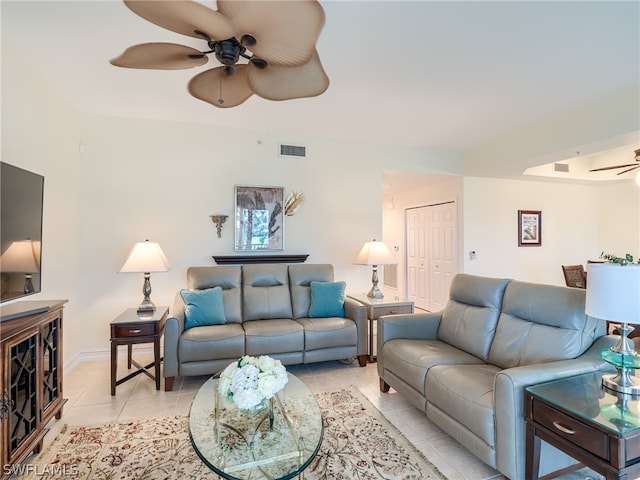 living room with light tile patterned floors and ceiling fan