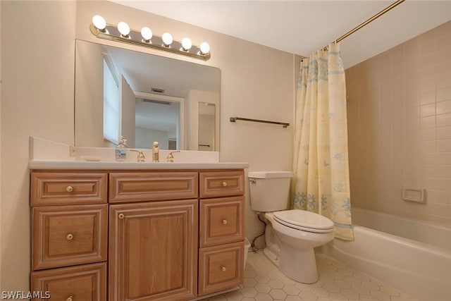 full bathroom featuring toilet, tile patterned flooring, shower / tub combo with curtain, and vanity