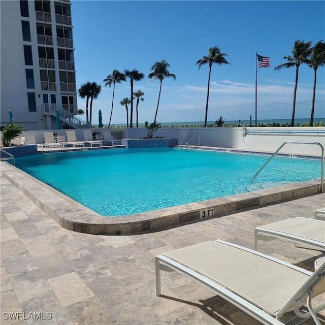 pool with a patio area