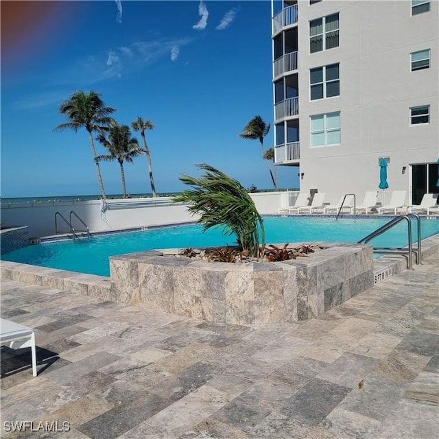 community pool with a patio