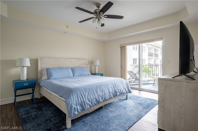 bedroom with wood-type flooring, ceiling fan, and access to outside