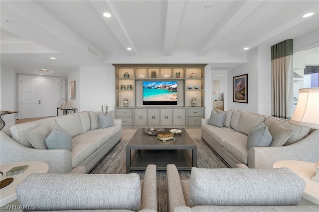 living room featuring dark wood-type flooring and beam ceiling