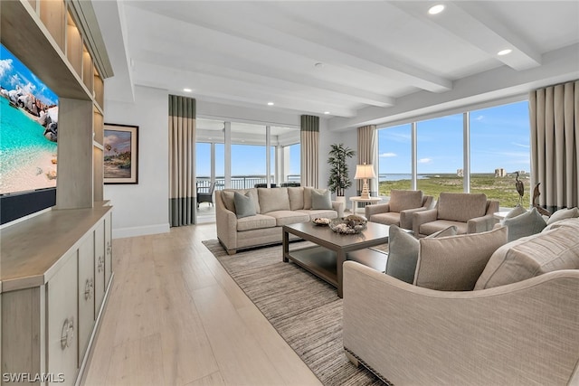 living room featuring beam ceiling and light wood-type flooring