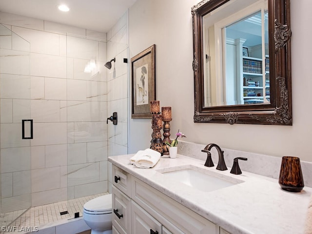 full bathroom featuring toilet, a stall shower, recessed lighting, and vanity