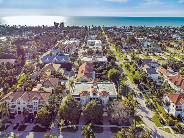 birds eye view of property with a water view and a residential view