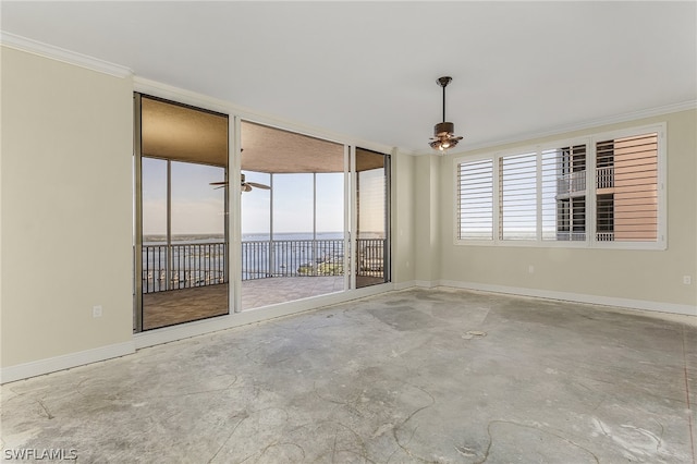 spare room featuring crown molding, plenty of natural light, and ceiling fan