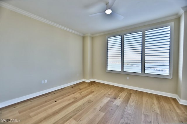 spare room featuring ornamental molding, ceiling fan, and light hardwood / wood-style flooring