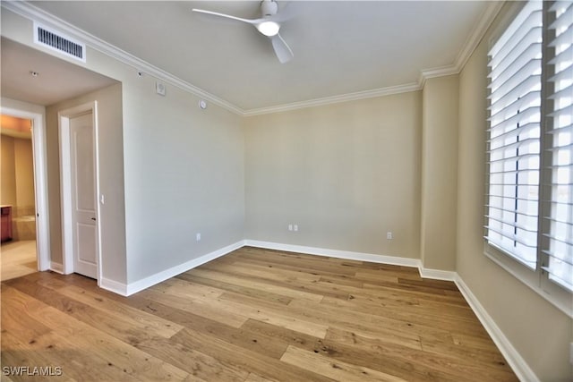 unfurnished room featuring crown molding, ceiling fan, and light hardwood / wood-style flooring