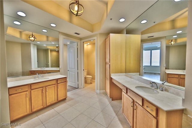 bathroom with tile patterned floors, toilet, and vanity