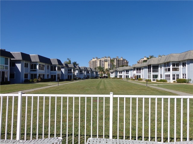 view of home's community with a yard