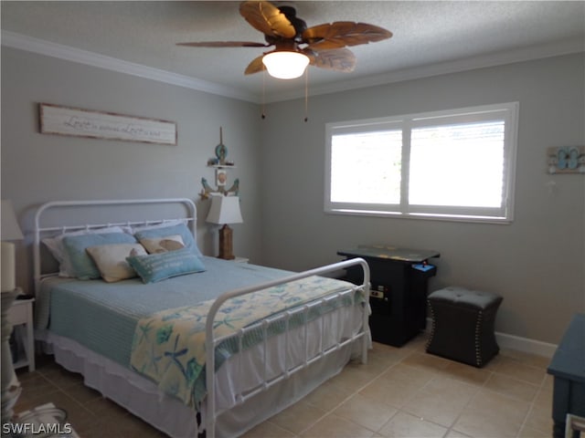 bedroom featuring ornamental molding, a textured ceiling, ceiling fan, and light tile floors