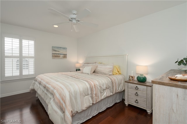 bedroom featuring dark hardwood / wood-style floors and ceiling fan