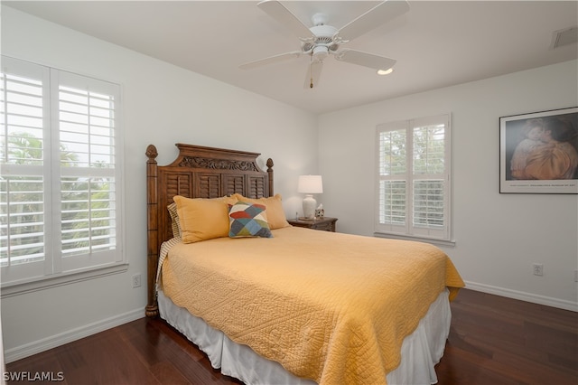 bedroom with dark wood-type flooring and ceiling fan