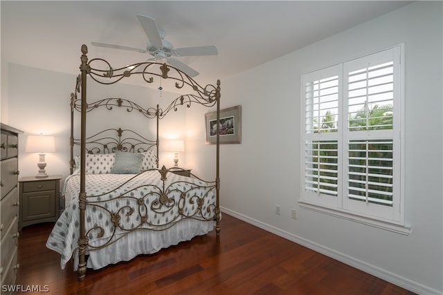 bedroom with dark hardwood / wood-style floors and ceiling fan