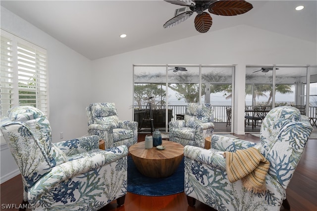 living room with lofted ceiling, plenty of natural light, and ceiling fan